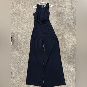Navy sleeveless jumpsuit with waist belt. This has never been worn!